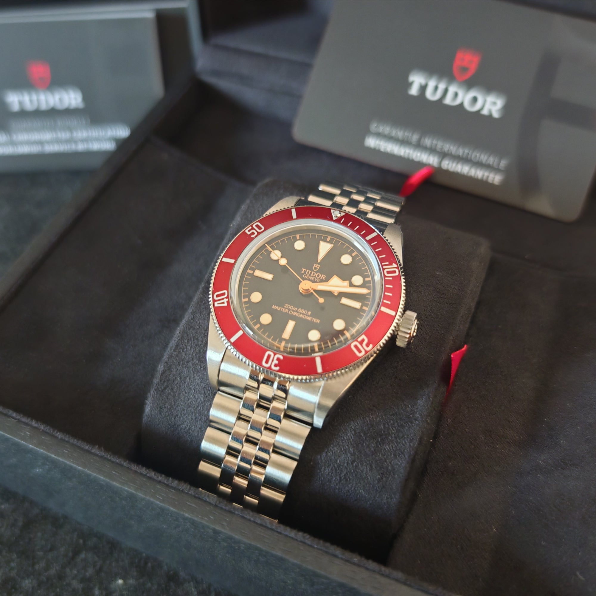 TUDOR Black Bay 41, red bezel, five-link stainless steel bracelet